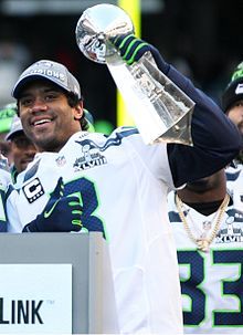 Russell_Wilson_2013_Super_Bowl]_Lombardi_Trophy